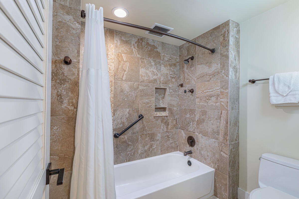 Princeville Vacation Rentals, Hanalei Bay Resort 1535/6 - Freshen up after the beach in this tiled bathroom with a tub and shower combo.