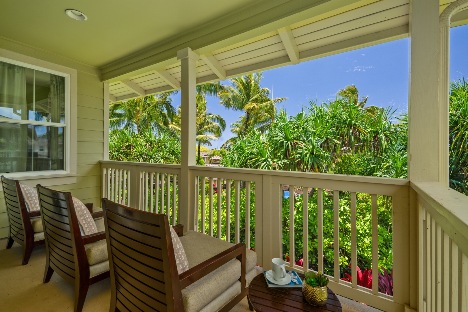 Princeville Vacation Rentals, Kaimana Villa - Sip your morning coffee surrounded by swaying palms and tropical blooms from your lanai..