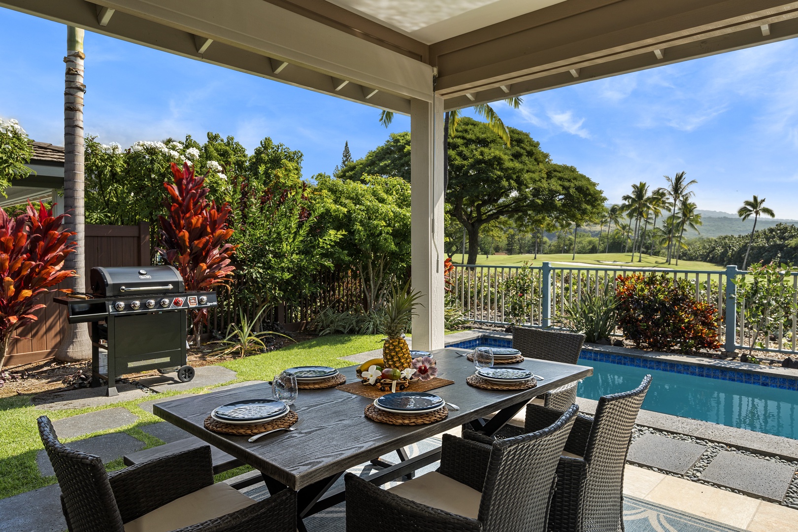 Kailua Kona Vacation Rentals, Kona Blue Vacations Holua Kai - Dine al fresco on the lanai at Kona Blue Vacations Holua Kai, surrounded by lush greenery and resort privacy.