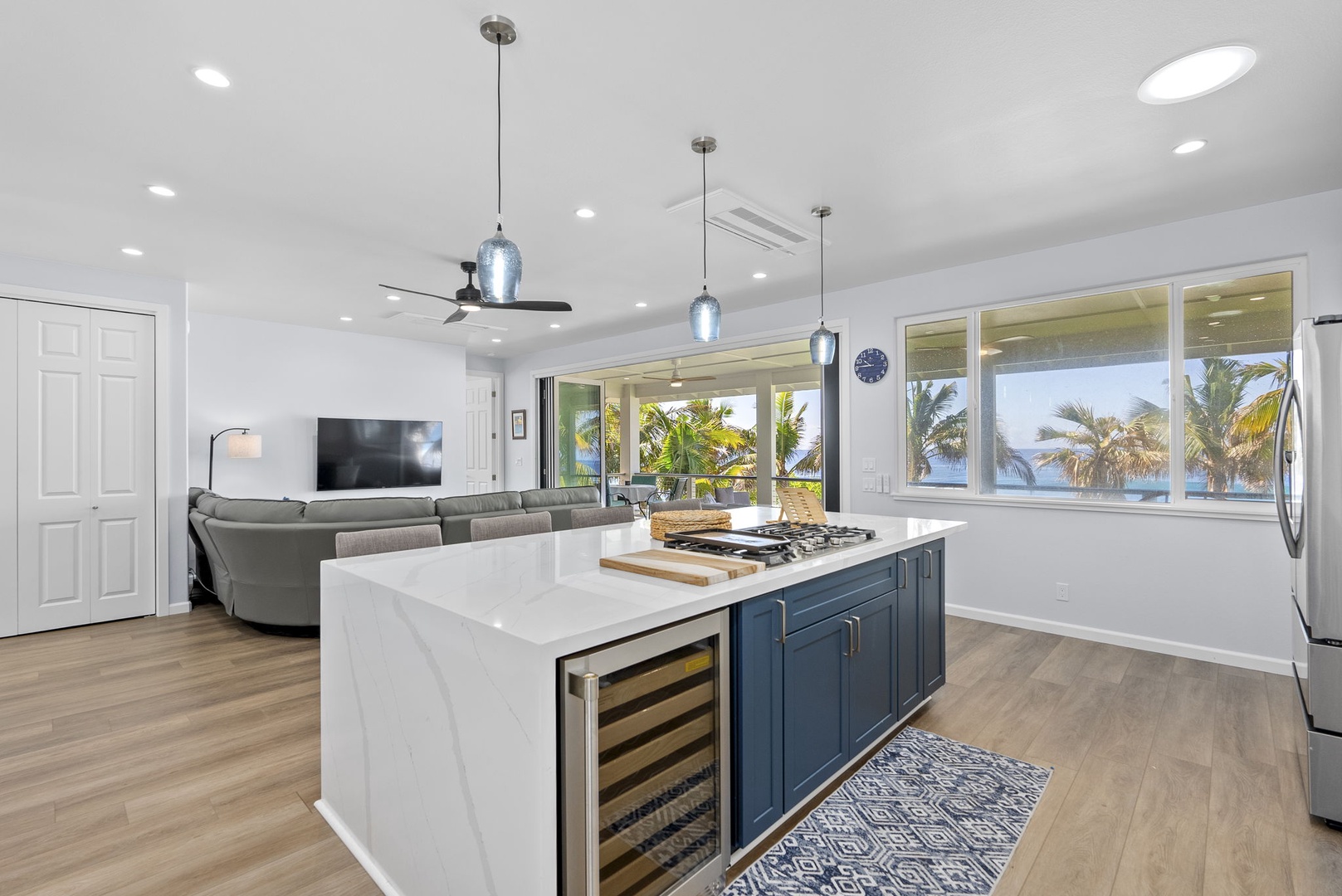 Waianae Vacation Rentals, Oceanfront Luxury Dream Estate - Wine fridge and prep island enhance the modern kitchen’s elevated amenities.