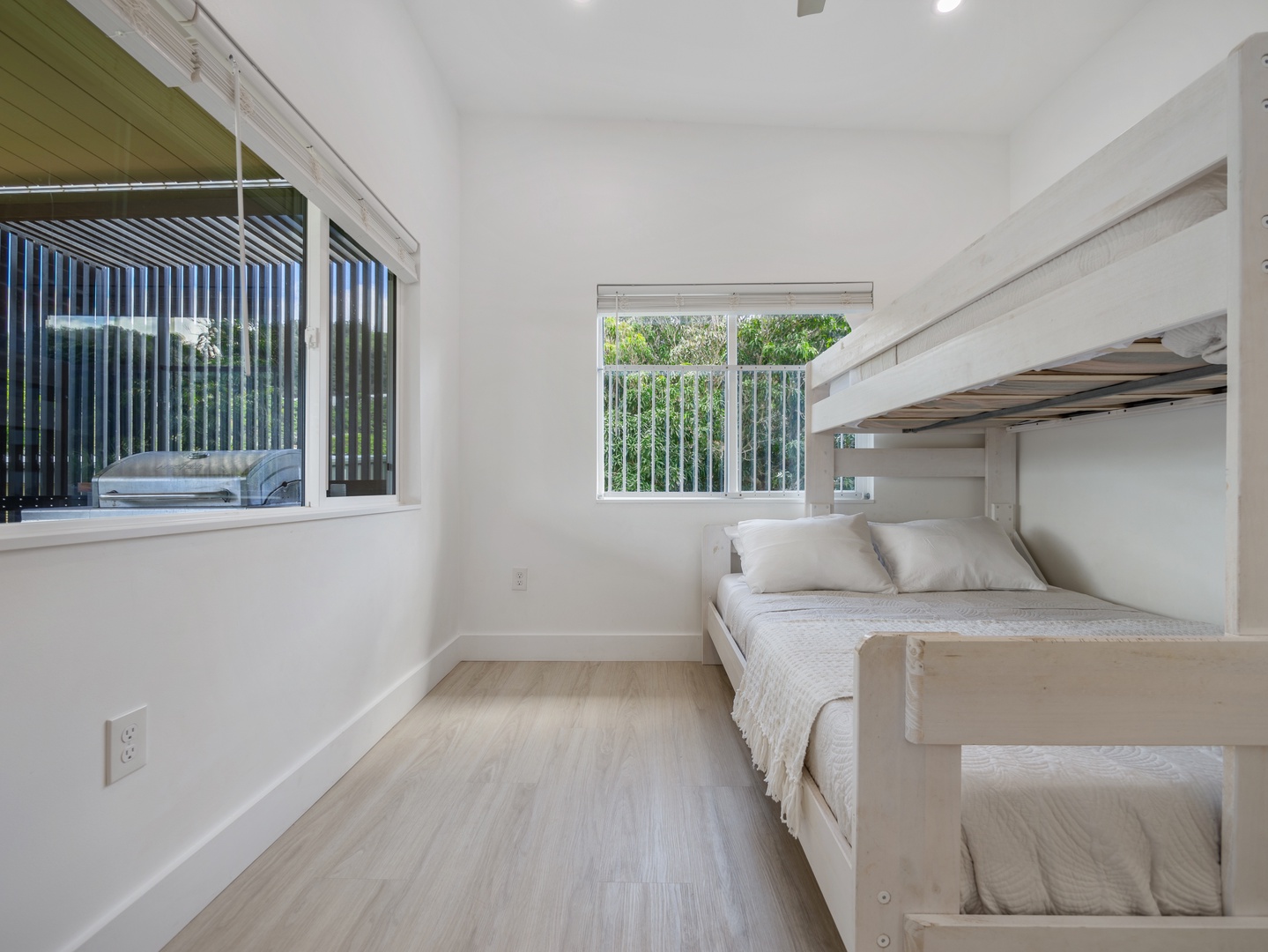 Haleiwa Vacation Rentals, Sunset Beach Island Retreat - This bright and airy bunk room is perfect for kids or extra guests, offering a twin over full-size bunk beds.