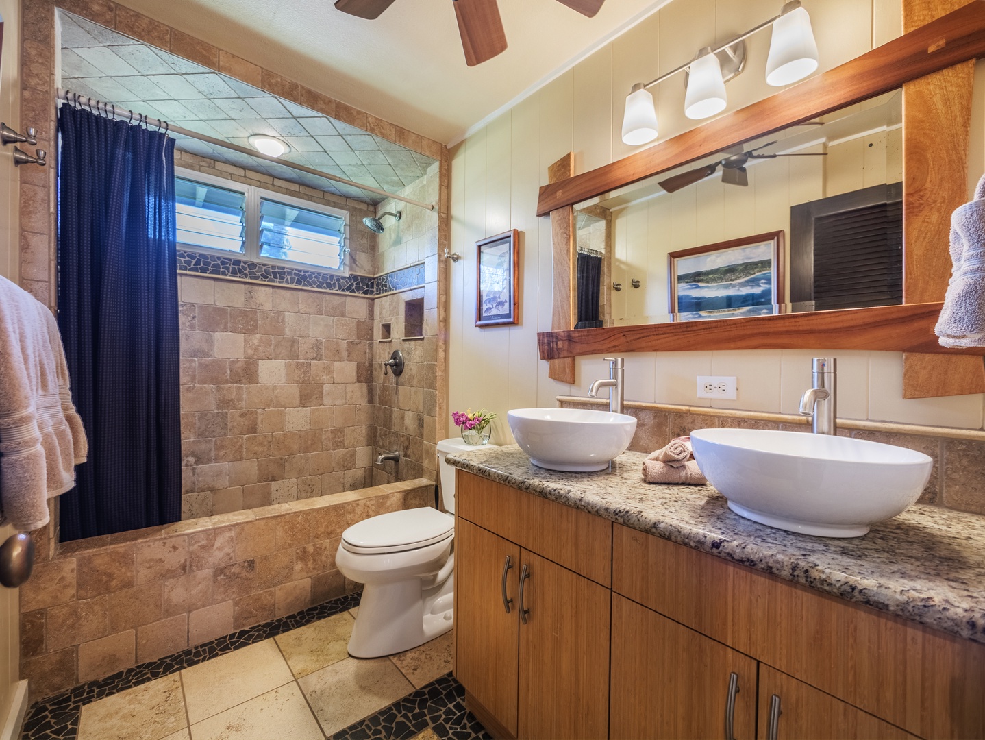 Haleiwa Vacation Rentals, Sunset Point Hawaiian Beachfront** - Ensuite bathroom with dual sinks and a walk-in shower.