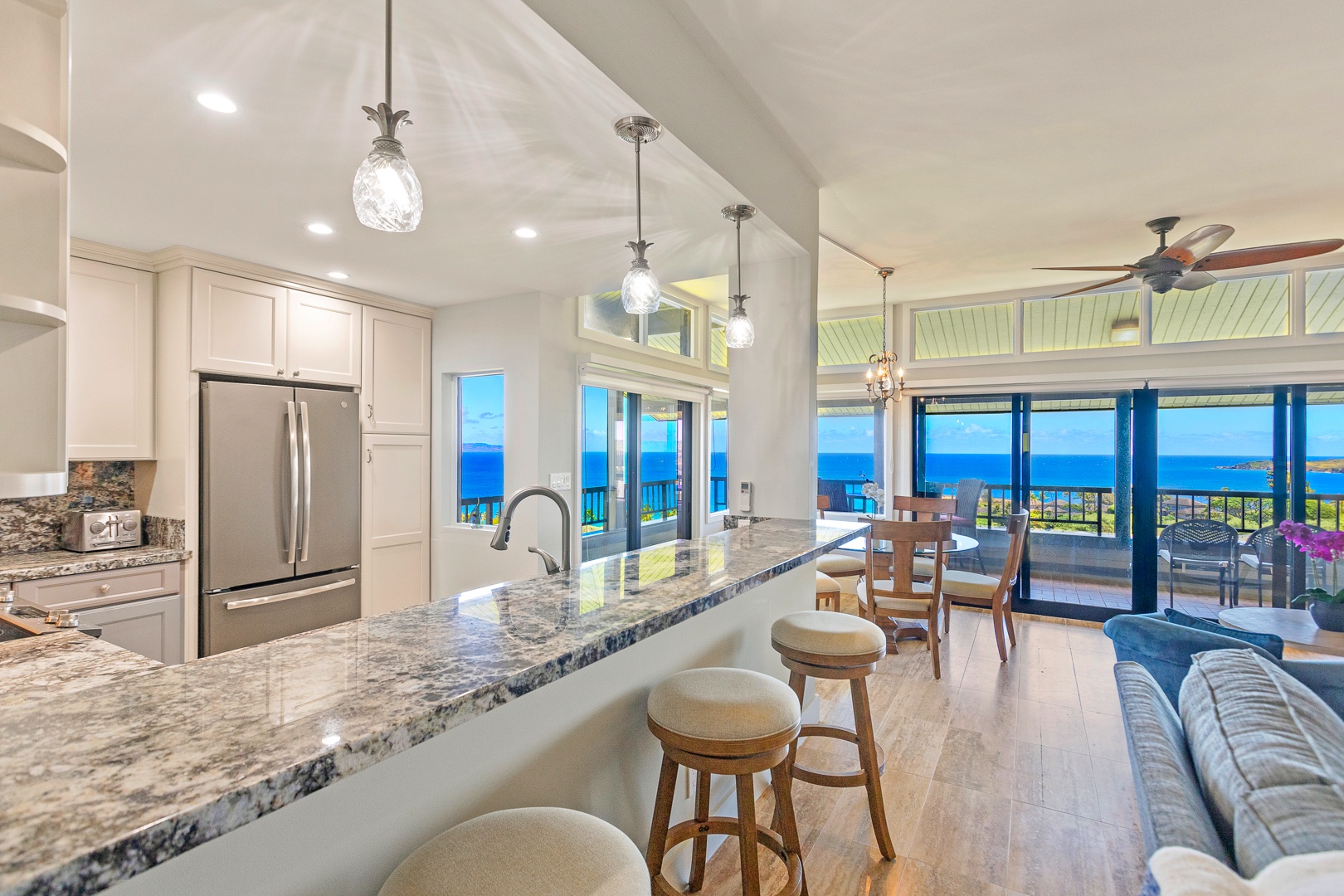 Lahaina Vacation Rentals, Kapalua Ridge 1622 - The kitchen bar area offers a perfect spot to enjoy your morning coffee while taking in panoramic ocean views.