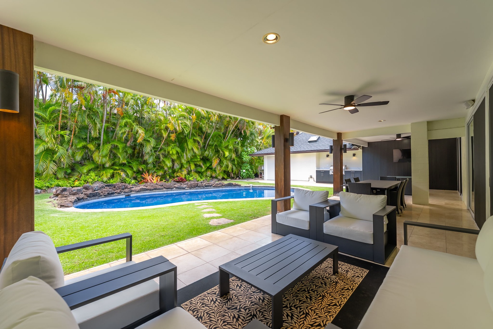 Honolulu Vacation Rentals, Kahala Lani - Another angle of the shaded lanai, overlooking the pool for effortless relaxation.