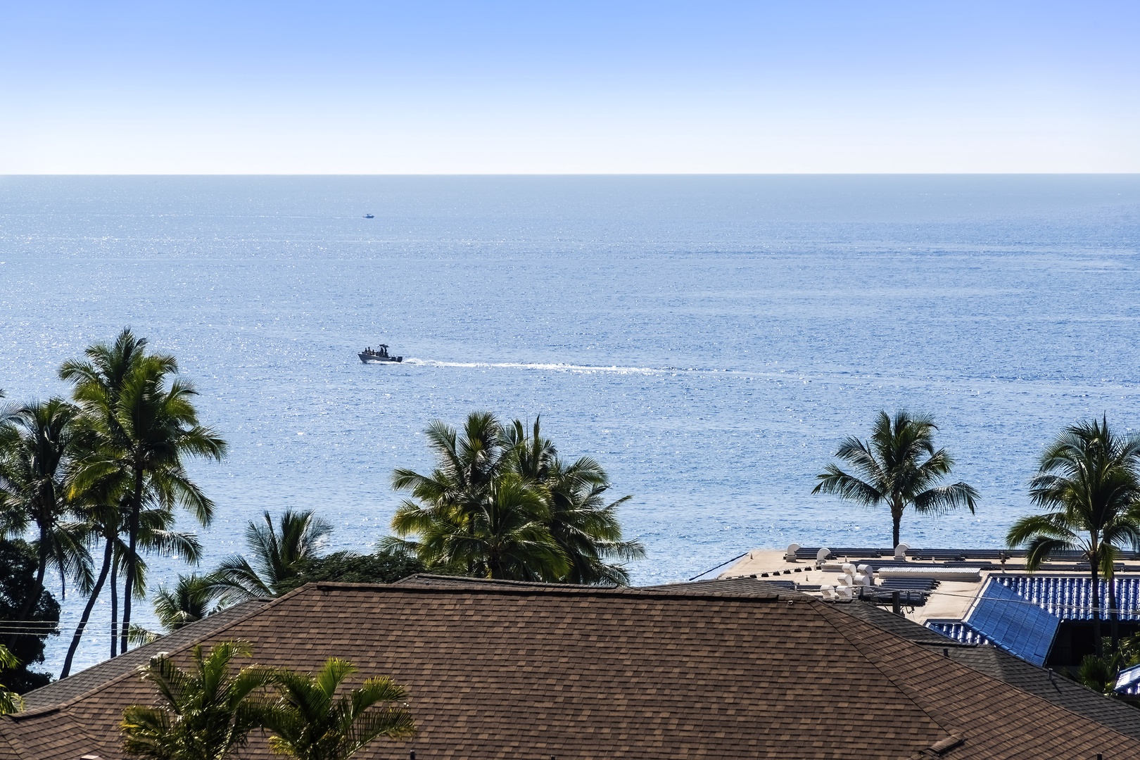 Kailua-Kona Vacation Rentals, Kona Mansions D231 - Zoomed view over the roof of the building in front