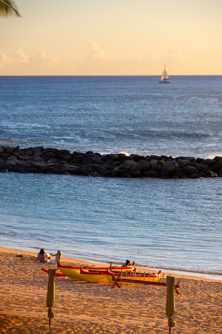 Kapolei Vacation Rentals, Ko Olina Beach Villas B210 - Golden sunset over the breakwater and open ocean.