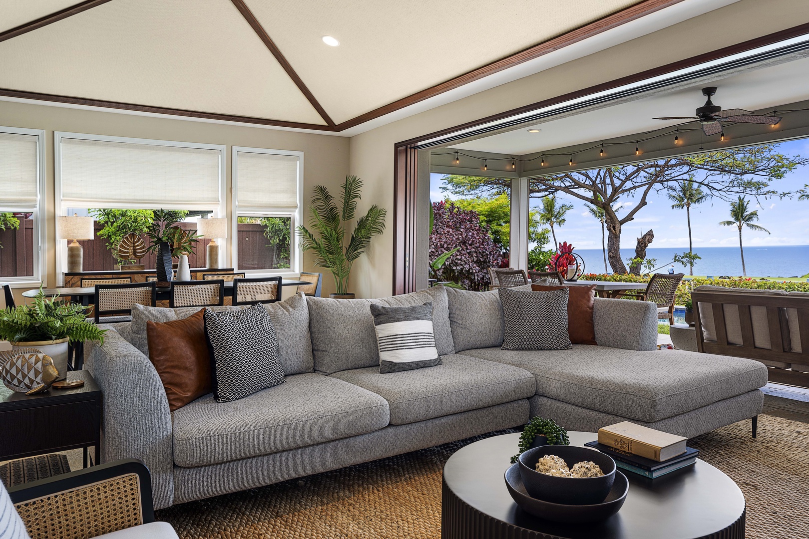 Kailua Kona Vacation Rentals, Holua Kai #27 - Pocket doors fold the great room open to the lanai and the green beyond.