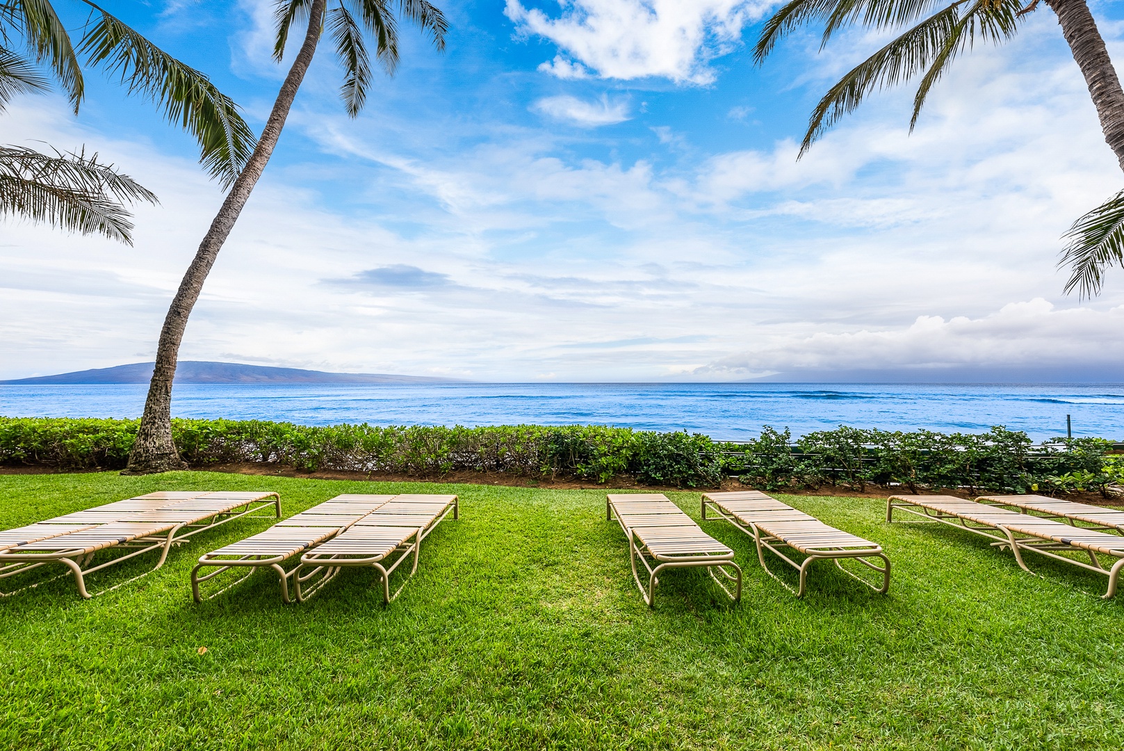Lahaina Vacation Rentals, Mahana 1119 - Relax in a lounge chair on the lawn at Mahana 1119 where the waves are just steps away.