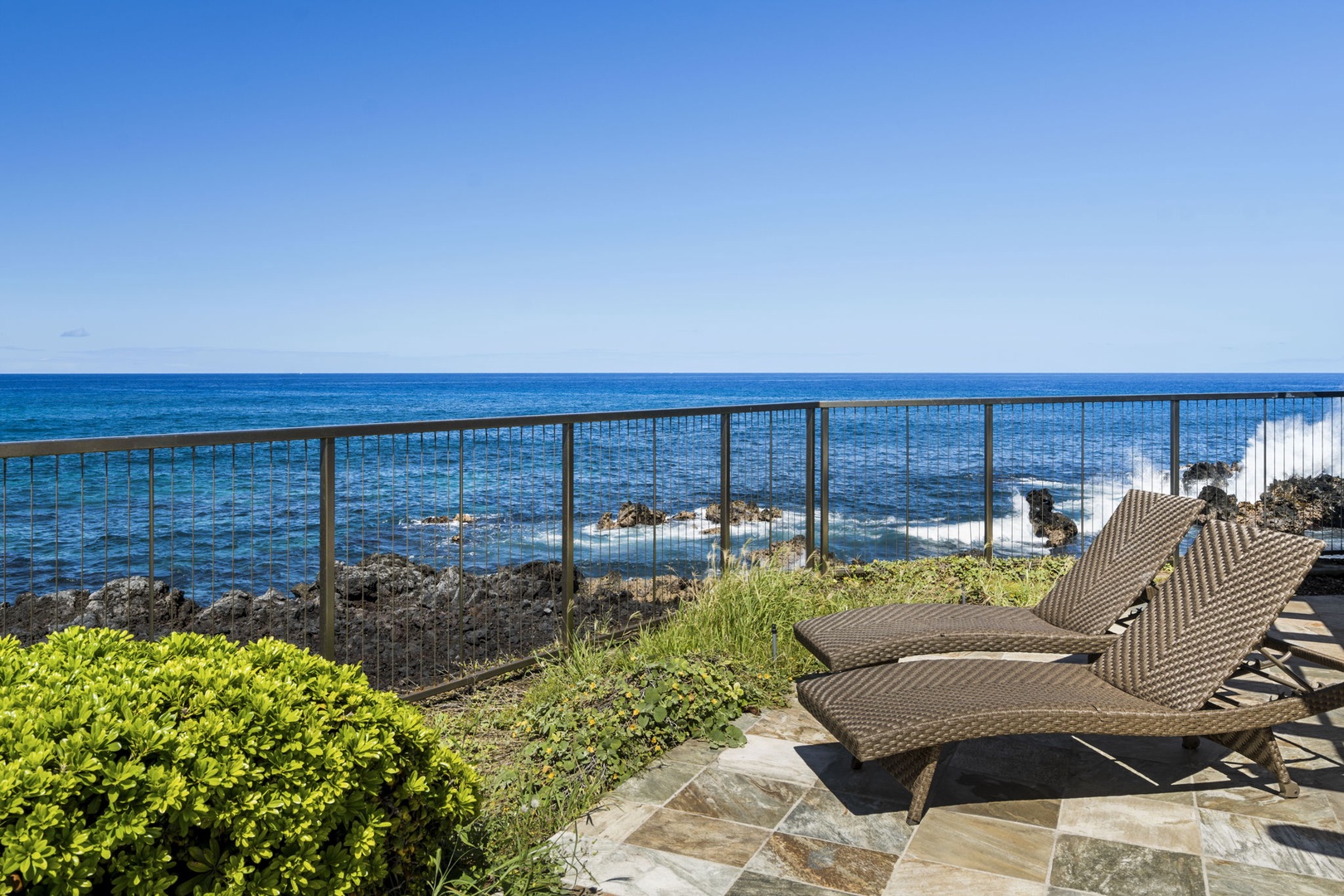 Kailua Kona Vacation Rentals, Kanaloa at Kona 701 - Oceanfront pool deck with stunning sea views, comfortable lounge chairs, and the soothing sound of waves below.