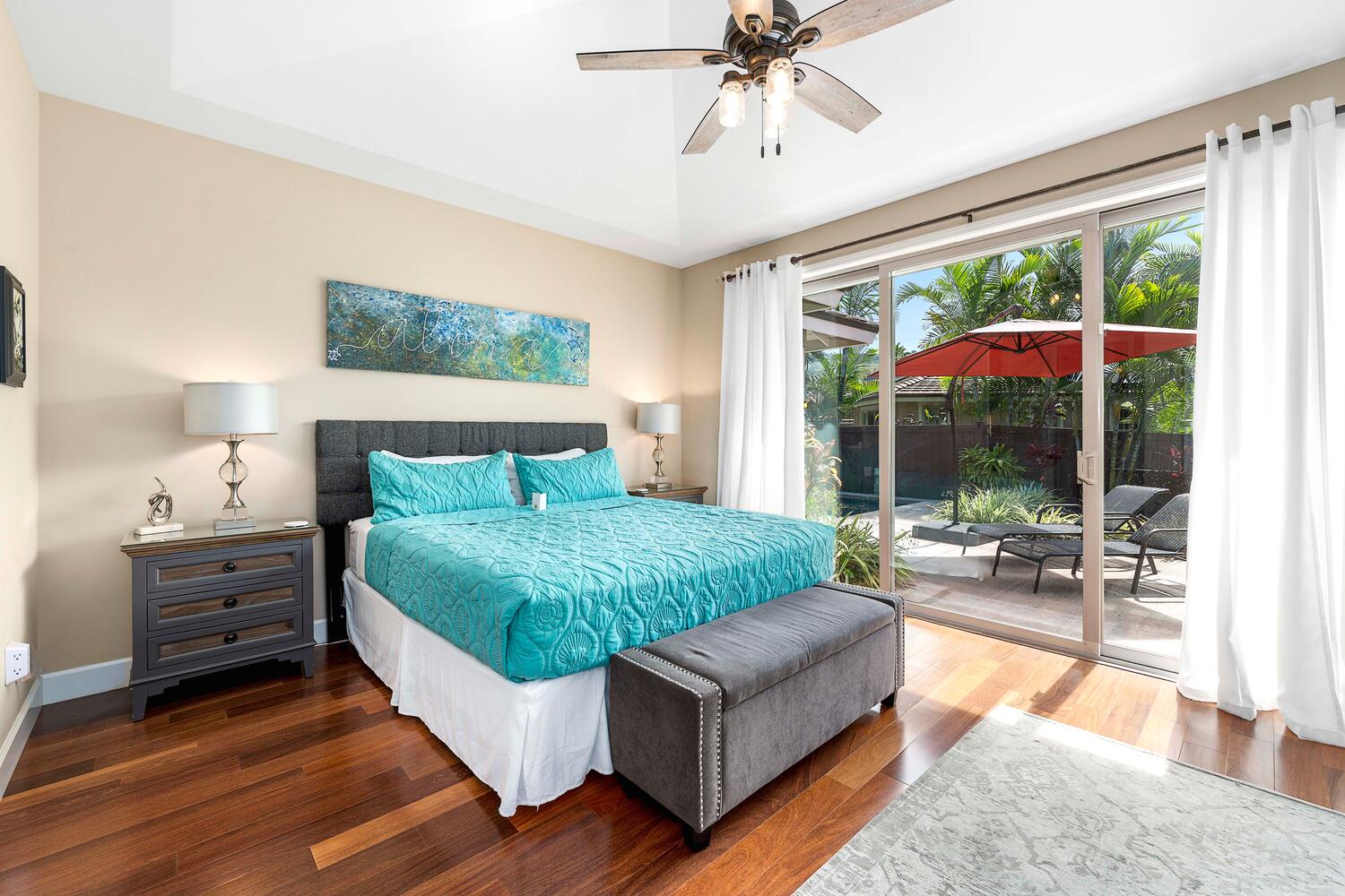 Kailua Kona Vacation Rentals, Holua Kai #32 - The sumptuous primary suite offers a king-size bed, a garden and pool view.