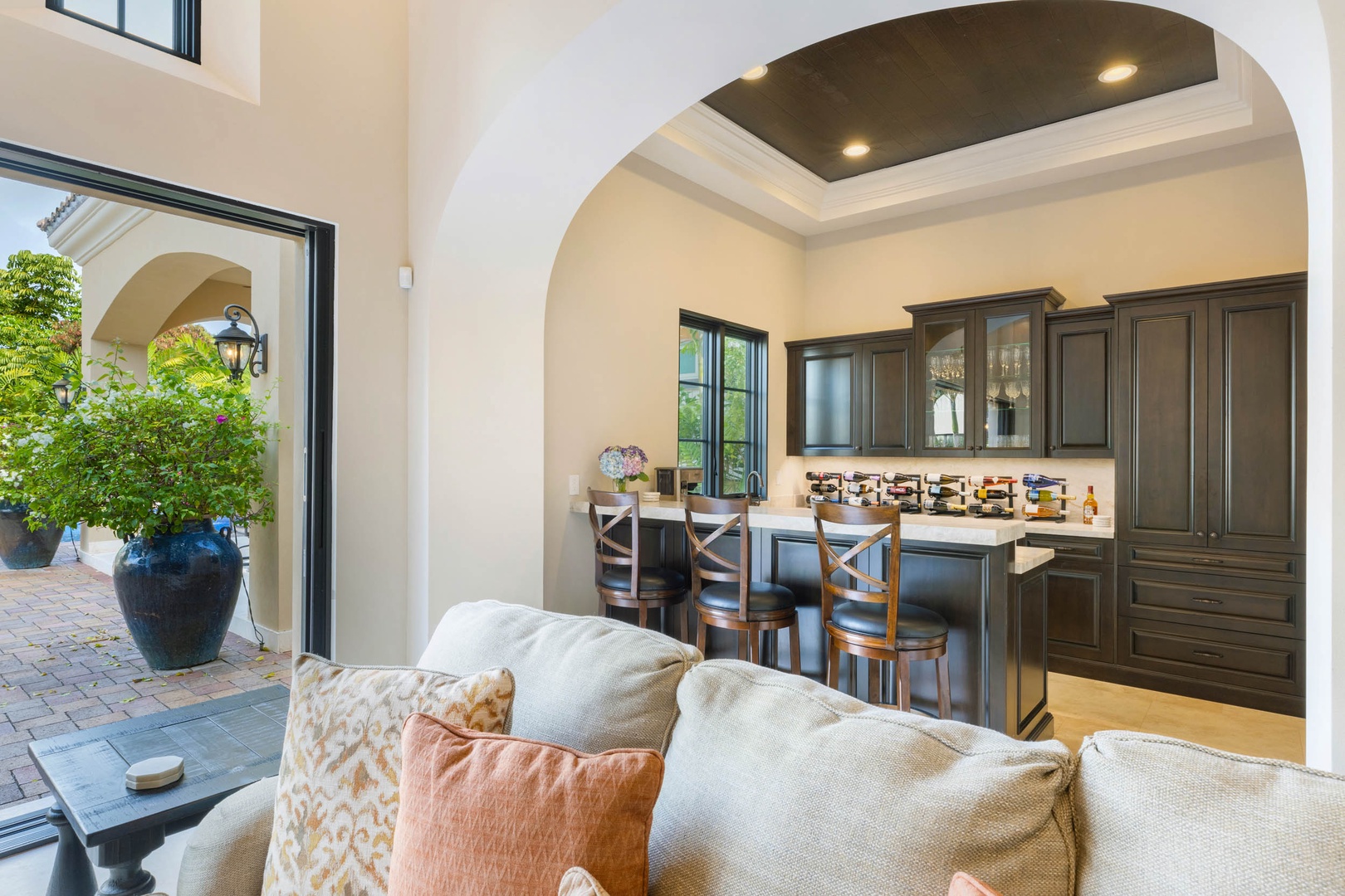 Honolulu Vacation Rentals, The Kahala Mansion Event Venue - Cozy lounge area near a kitchenette, offering a relaxed spot to gather with friends or family.