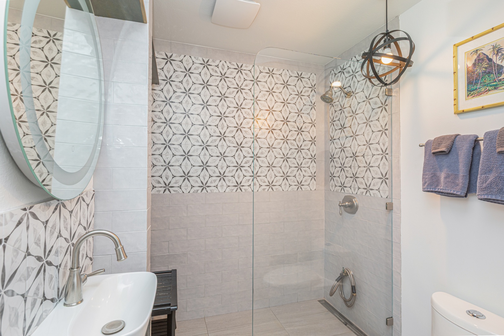 Princeville Vacation Rentals, Pohaku Kauai - Bright downstairs bathroom with walk-in shower, custom tile, and plenty of natural light.