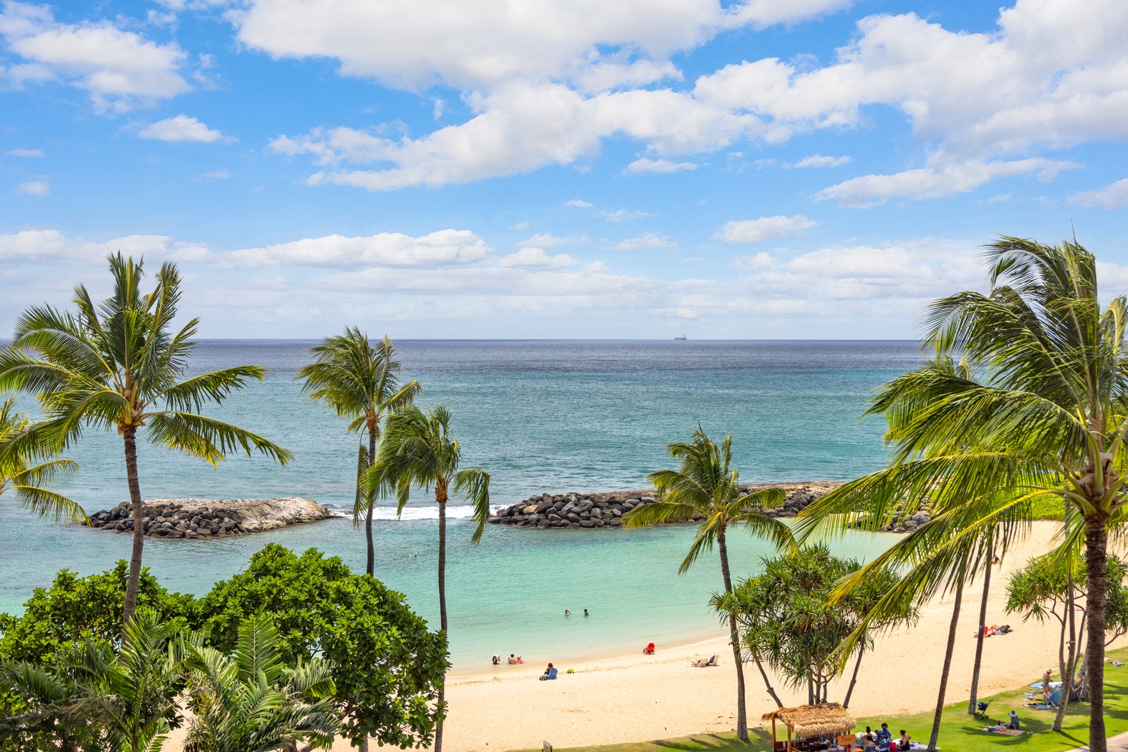 Kapolei Vacation Rentals, Ko Olina Beach Villas B506 - Tropical paradise with pristine beach, swaying palms, and crystal-clear turquoise waters in the surrounding area.