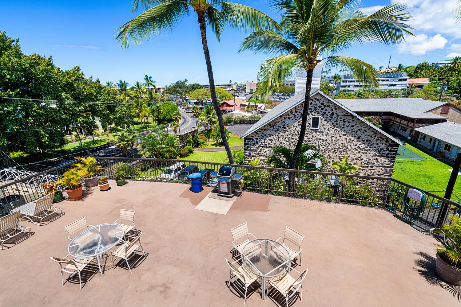 Kailua Kona Vacation Rentals, Kona Plaza 201 - Surrounded by swaying palms and tropical views, perfect for your morning coffee or evening barbecue gathering.