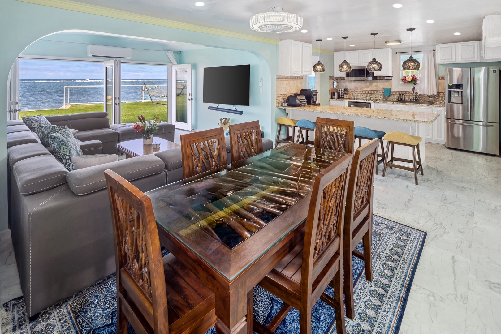 Hauula Vacation Rentals, Private Beach Paradise - Dinner at a table this size, with the ocean filling the windows behind every seat.