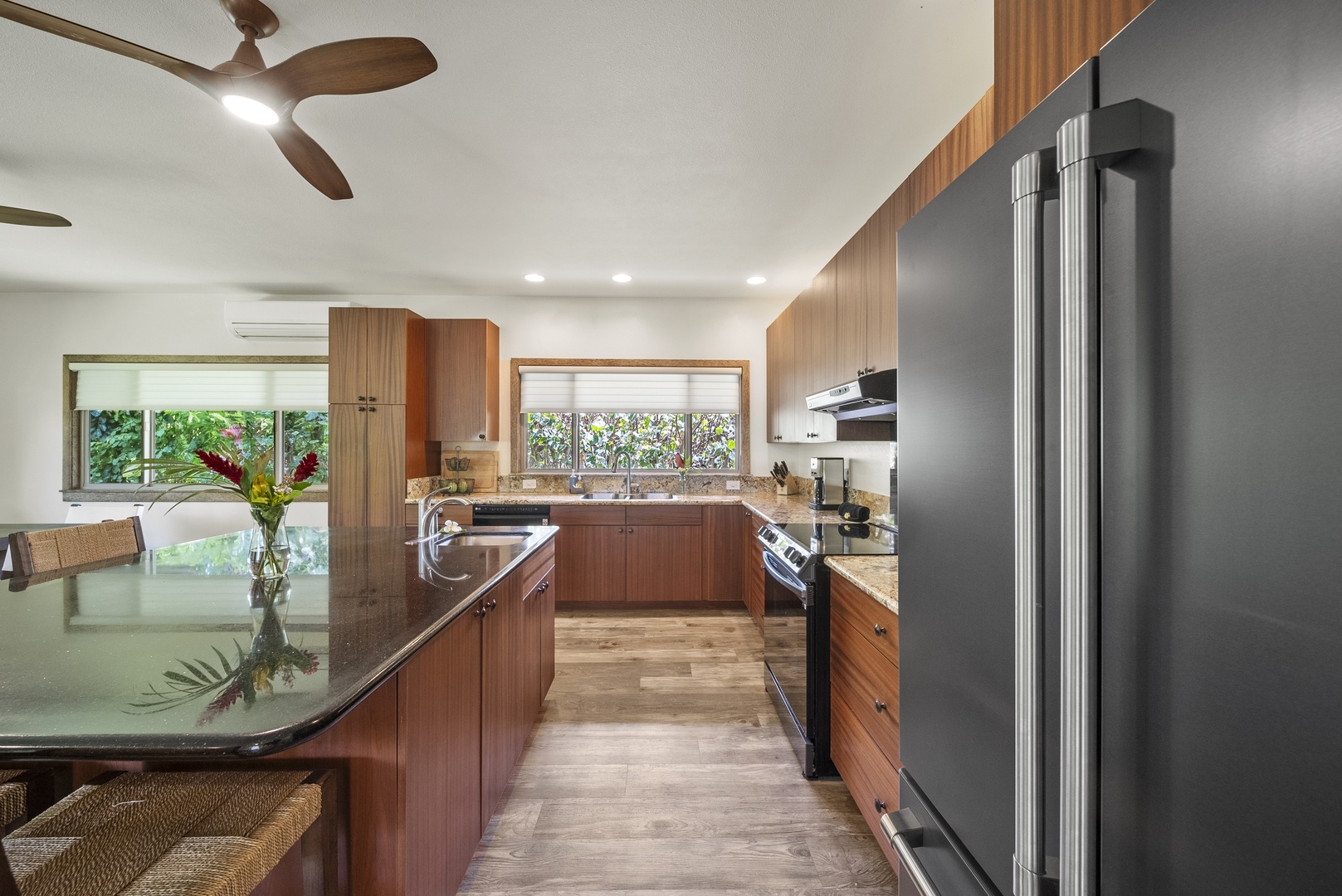 Haleiwa Vacation Rentals, Kaunala Retreat - Bar seating at the kitchen island adds a casual spot for morning bites or evening conversation.