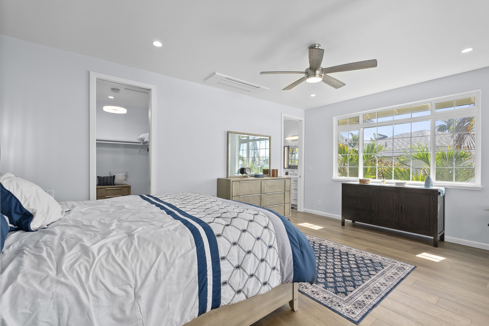 Waianae Vacation Rentals, Oceanfront Luxury Dream Estate - Spacious second-floor guest suite featuring large windows, crisp linens, and soothing coastal tones.