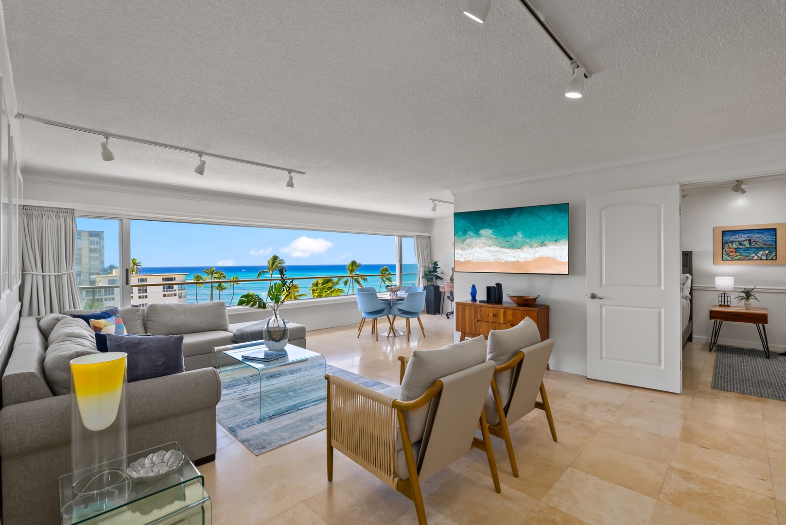 Honolulu Vacation Rentals, Colony Surf Getaway - Spacious and modern living area with seamless indoor-outdoor flow for a tranquil retreat.