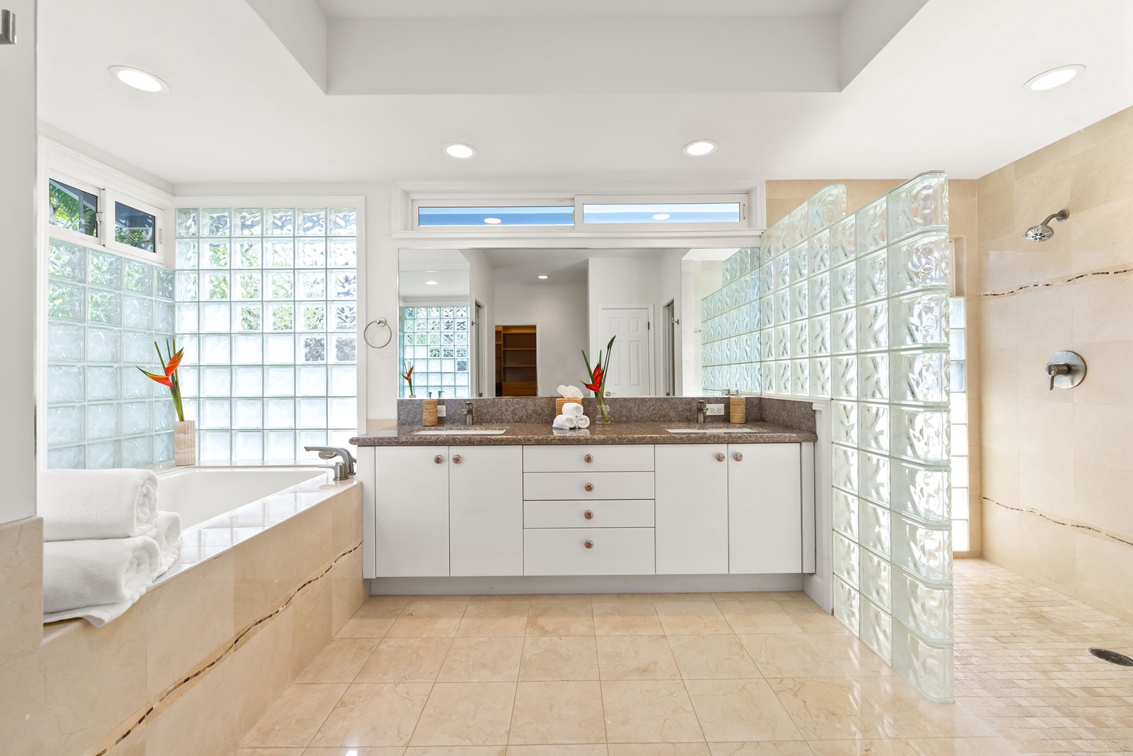Kailua Vacation Rentals, Kailua Beach House - Spacious master bath with double vanity and natural light for a relaxed morning routine.