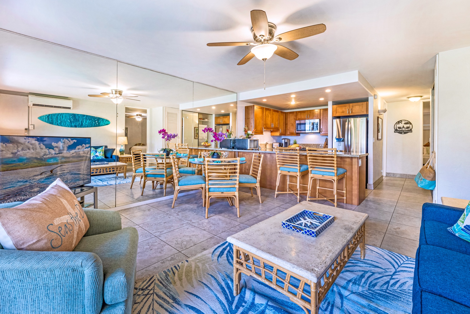 Lahaina Vacation Rentals, Papakea K-105 - The spacious open-concept living and dining area flows seamlessly into the kitchen, offering a comfortable space for entertaining family and friends.