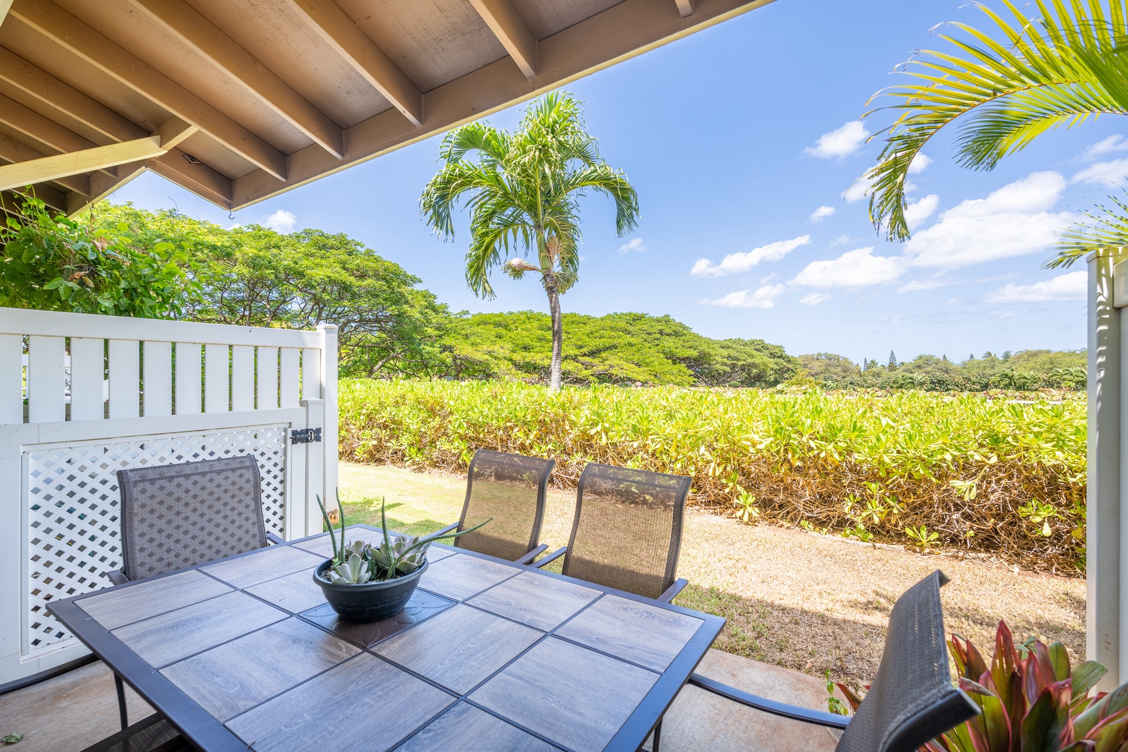 Kapolei Vacation Rentals, Hillside Villas 1496-2 - The tranquil backyard where you can dine al fresco on the lanai.