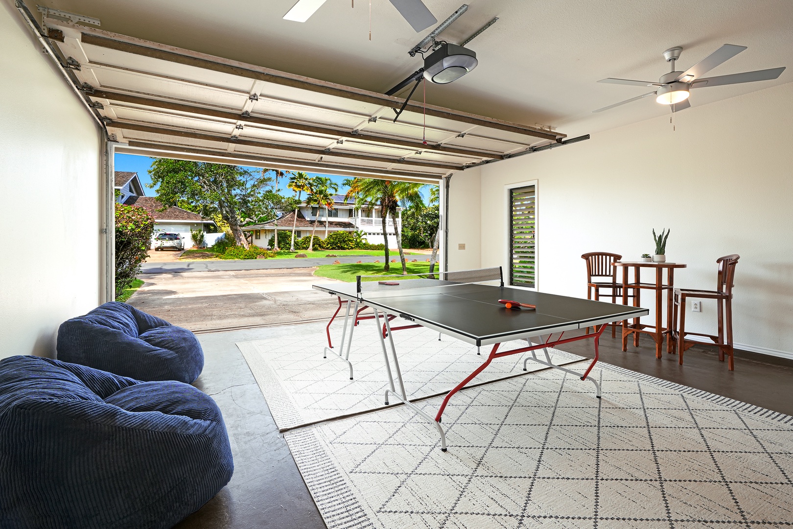 Koloa Vacation Rentals, Plantation Cottage at Poipu - Your private game room opens to tropical views, featuring table tennis and cozy seating for endless entertainment.
