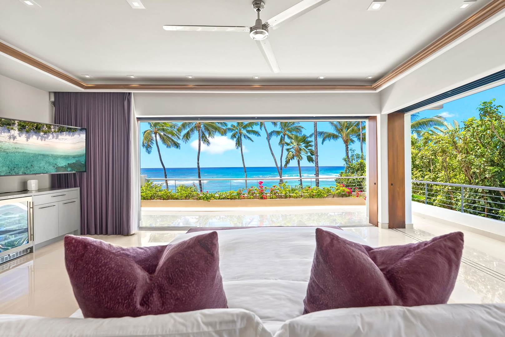 Honolulu Vacation Rentals, Diamond Head Beachfront Estate - Sink into plush seating as you gaze out at swaying palms and turquoise waters framing your private tropical paradise, where modern elegance meets beachfront bliss.