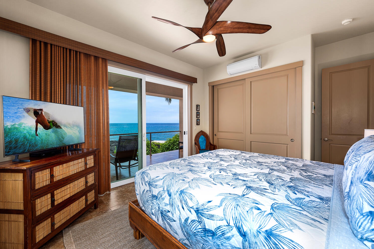 Kailua Kona Vacation Rentals, Kailani Vista - Soft blues echo the sea beyond the window, and a ceiling fan keeps island breezes moving when guests turn in for the night.
