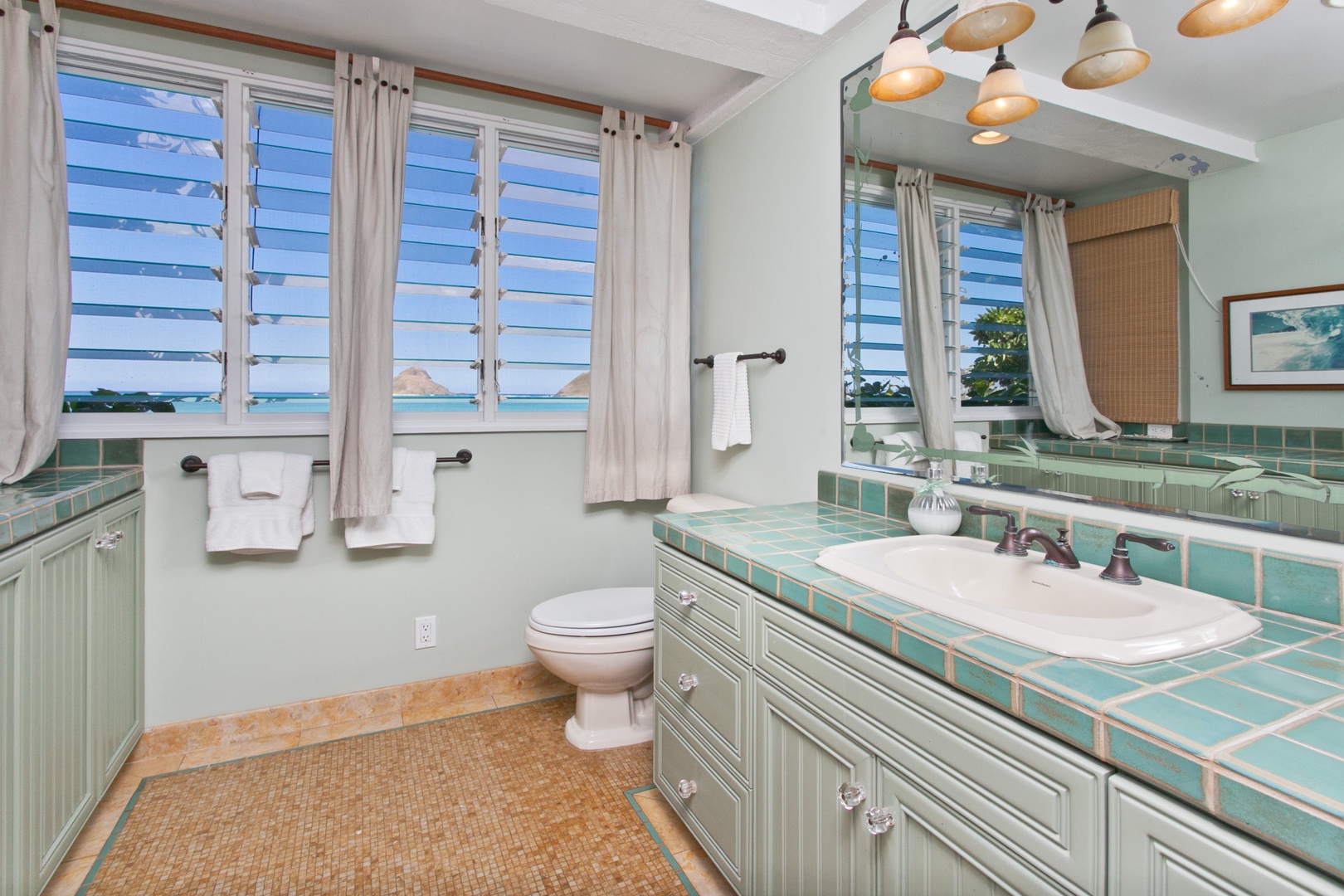 Kailua Vacation Rentals, Hale Kainalu* - Primary ensuite bathroom has natural light and plenty of storage.