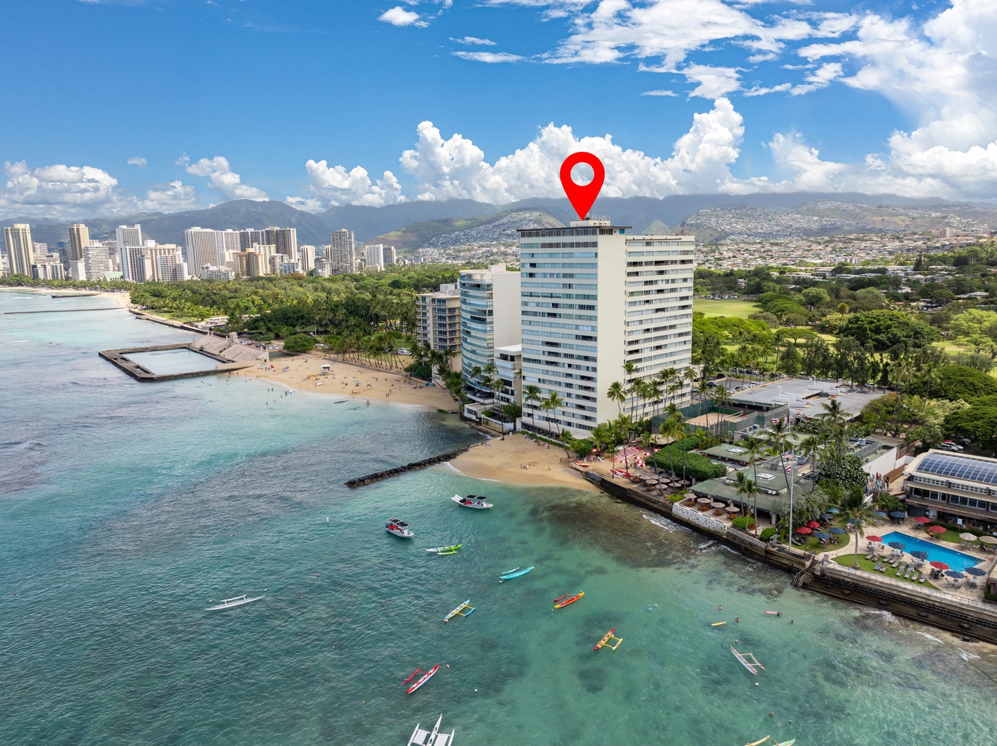 Honolulu Vacation Rentals, Colony Surf Getaway - Aerial view highlighting the property’s prime location between the ocean and vibrant city life.