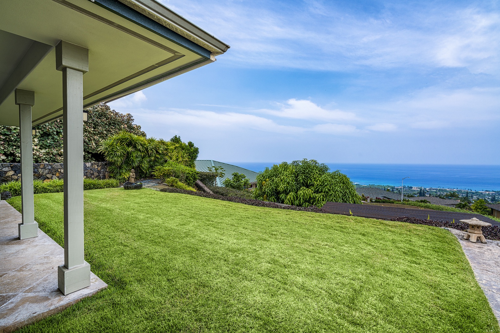 Kailua Kona Vacation Rentals, Sunset Hale - Expansive lawn frames panoramic views of Kamakahou Bay—ideal for sunset strolls or yoga.
