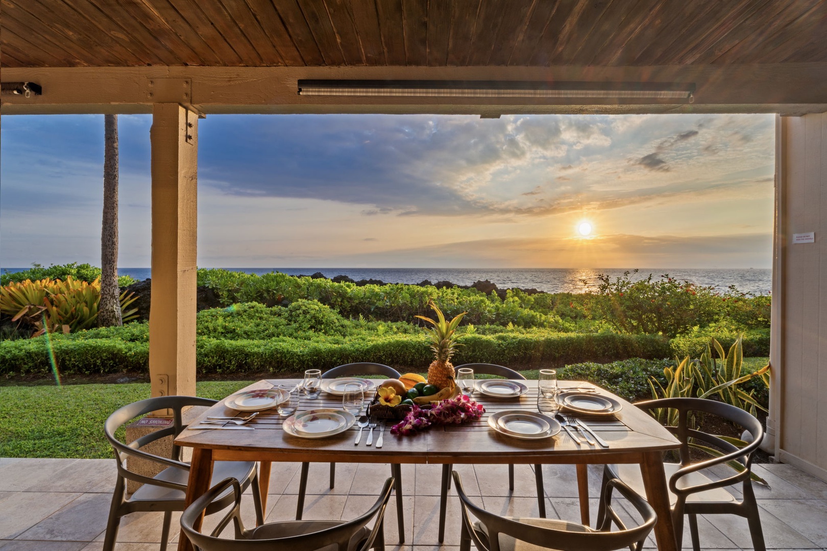 Kailua Kona Vacation Rentals, Keauhou Kona Surf & Racquet 1104 - Evening plates on the lanai while the sky over the water turns.