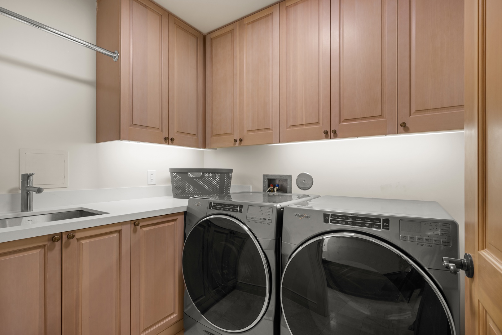 Kailua Kona Vacation Rentals, 3BD Palm Villa (130B) at Hualalai Resort - Your private laundry room features modern appliances and ample cabinet storage for all your travel essentials.