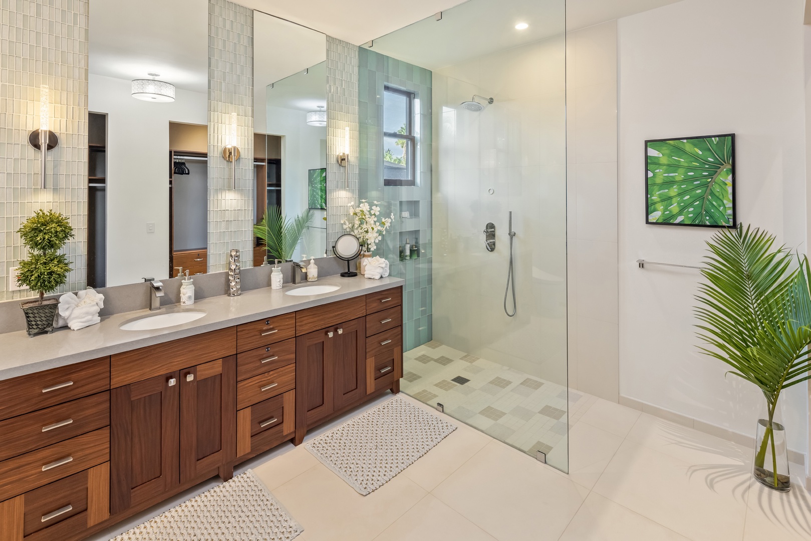 Honolulu Vacation Rentals, Kahala Grand Splendor - Luxurious en-suite bath with dual vanity and a glass-enclosed rain shower.