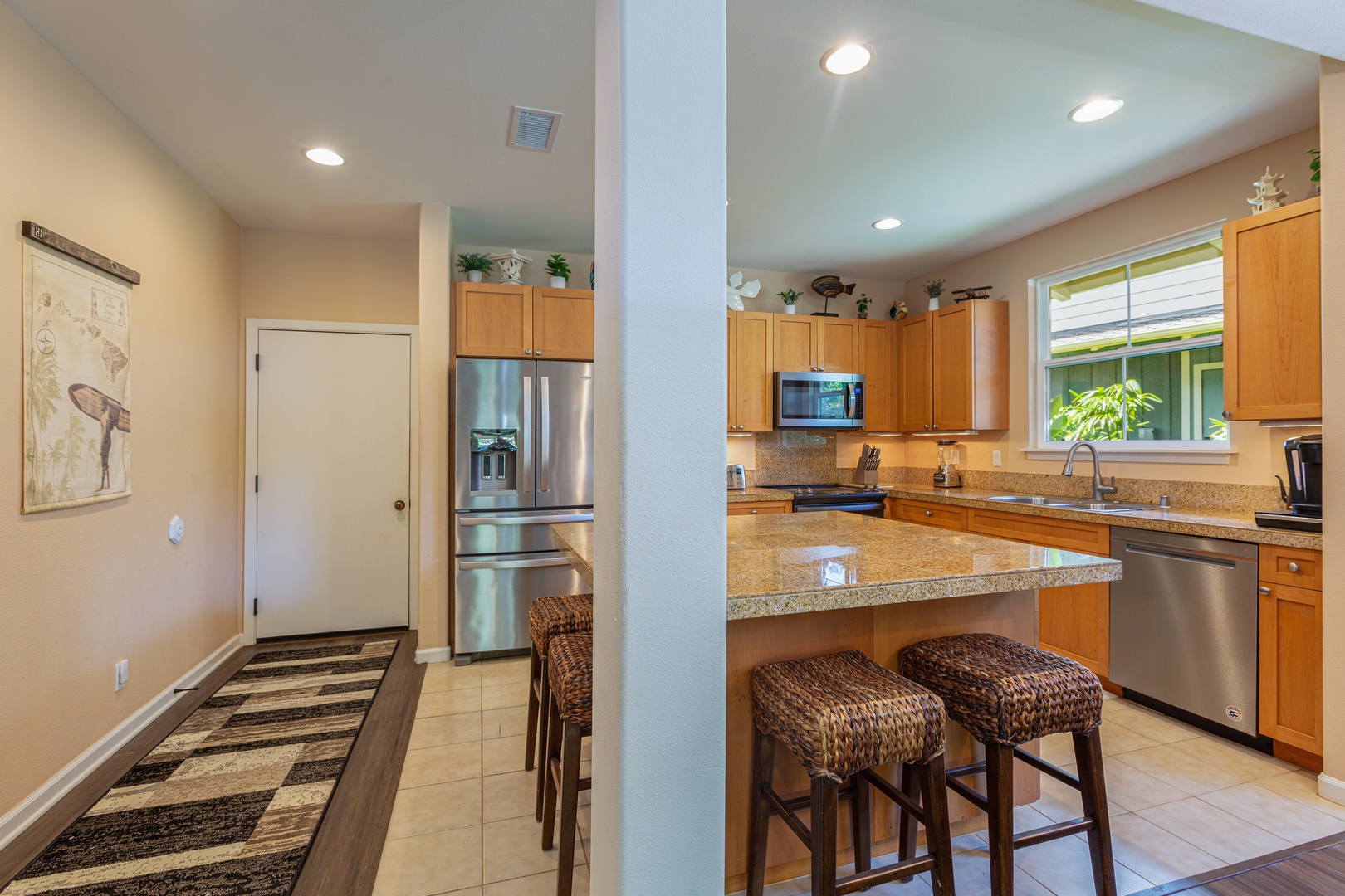 Princeville Vacation Rentals, Pualani Villa - The fully equipped kitchen offers modern appliances and a spacious layout for easy meal prep.