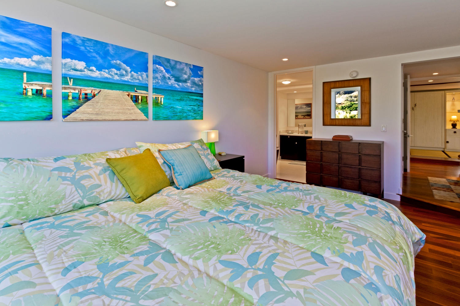 Honolulu Vacation Rentals, Executive Gold Coast Oceanfront Suite - Primary bedroom with a king-size bed. Television in room is not pictured.