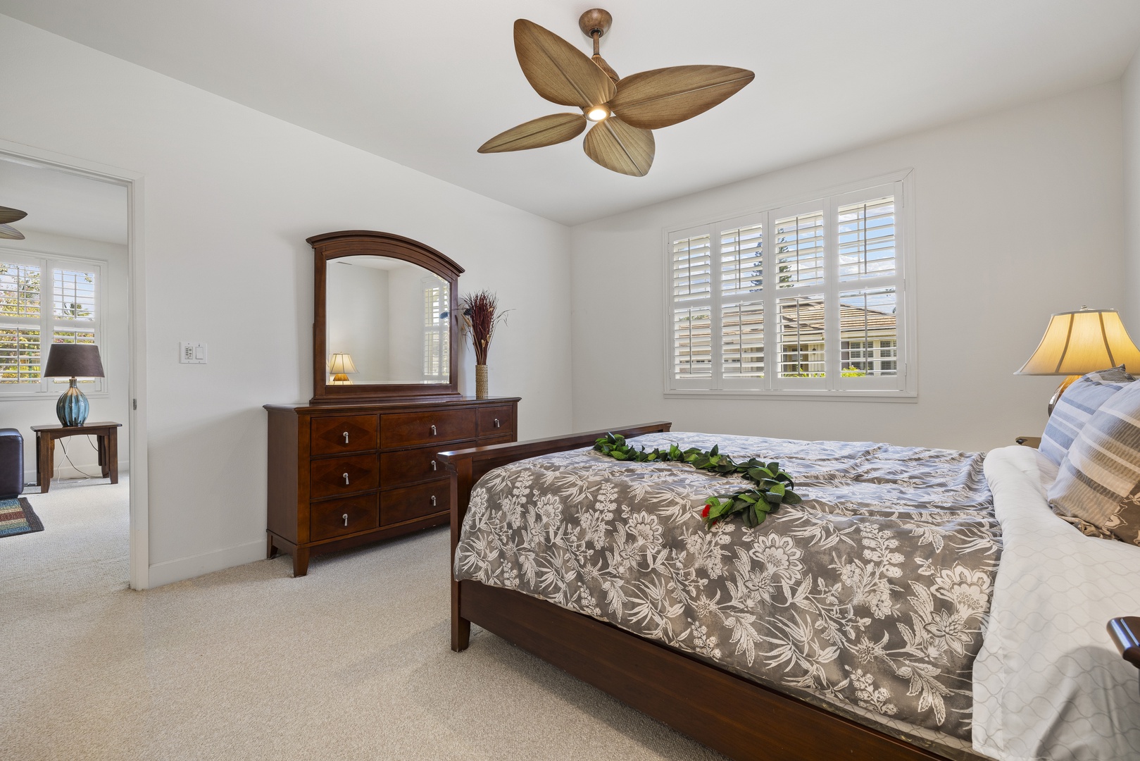 Enjoy a peaceful night's sleep in the inviting primary suite, thoughtfully furnished for comfort and relaxation.
