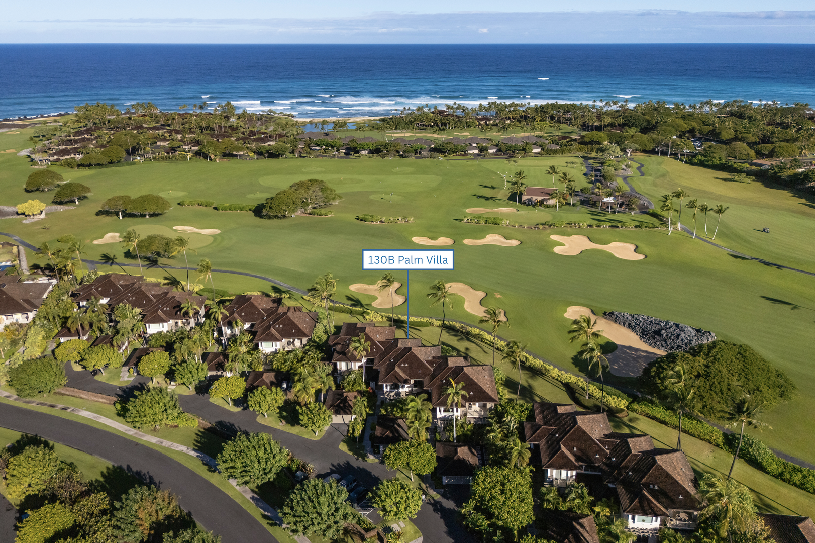 Kailua Kona Vacation Rentals, 3BD Palm Villa (130B) at Hualalai Resort - Ocean view golf course community with championship greens, sand traps, and tropical coastline stretching to the horizon.