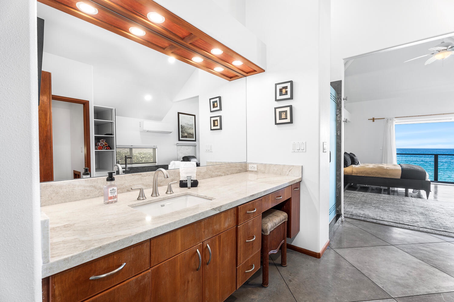 Kailua-Kona Vacation Rentals, Hale Kope Kai - Primary ensuite bath with dual sinks, custom lighting, and a walk-in shower.