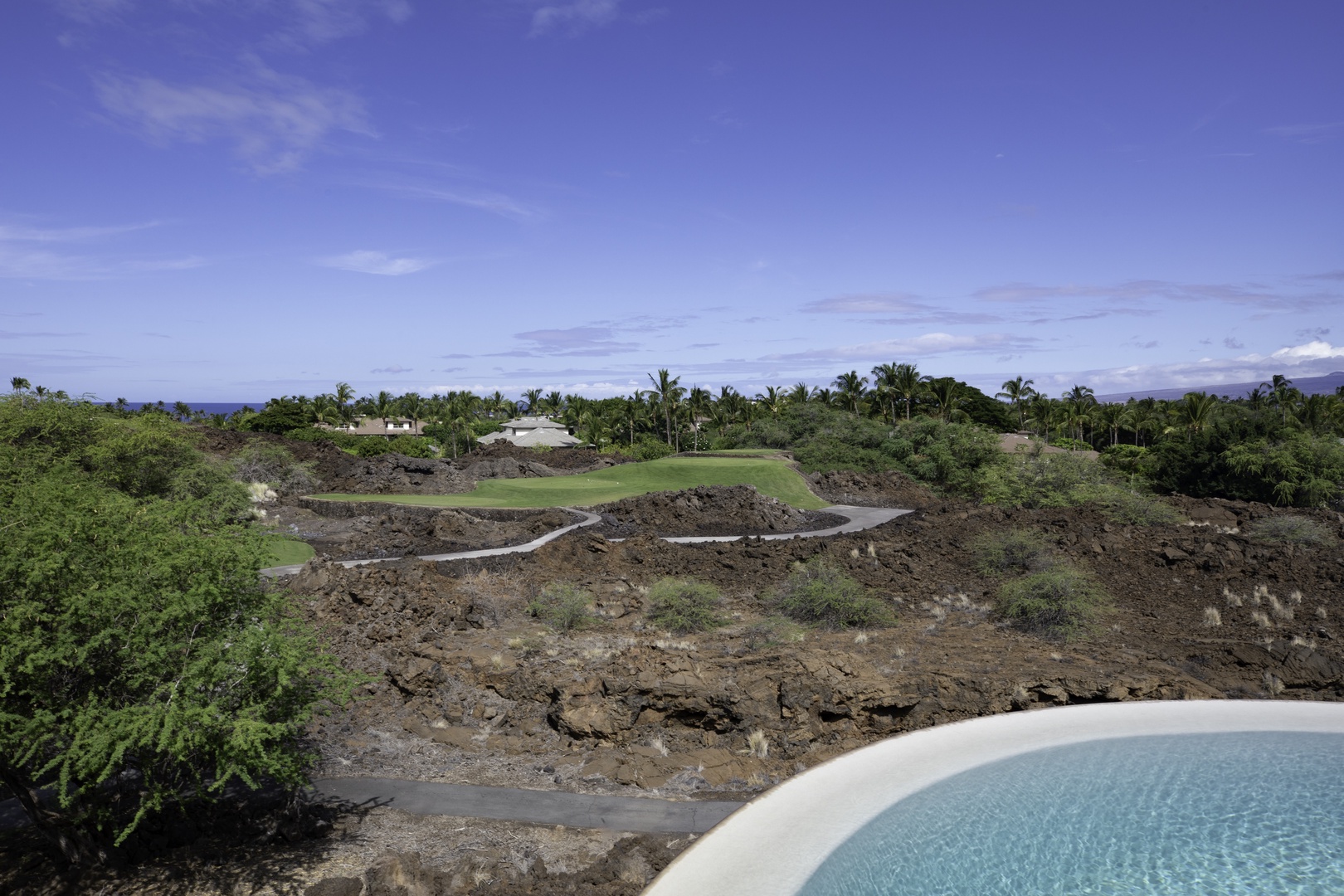 Kamuela Vacation Rentals, Champion Ridge 7 - Elevated property offers stunning vistas across lush tropical landscapes and distant golf fairways under endless blue skies.