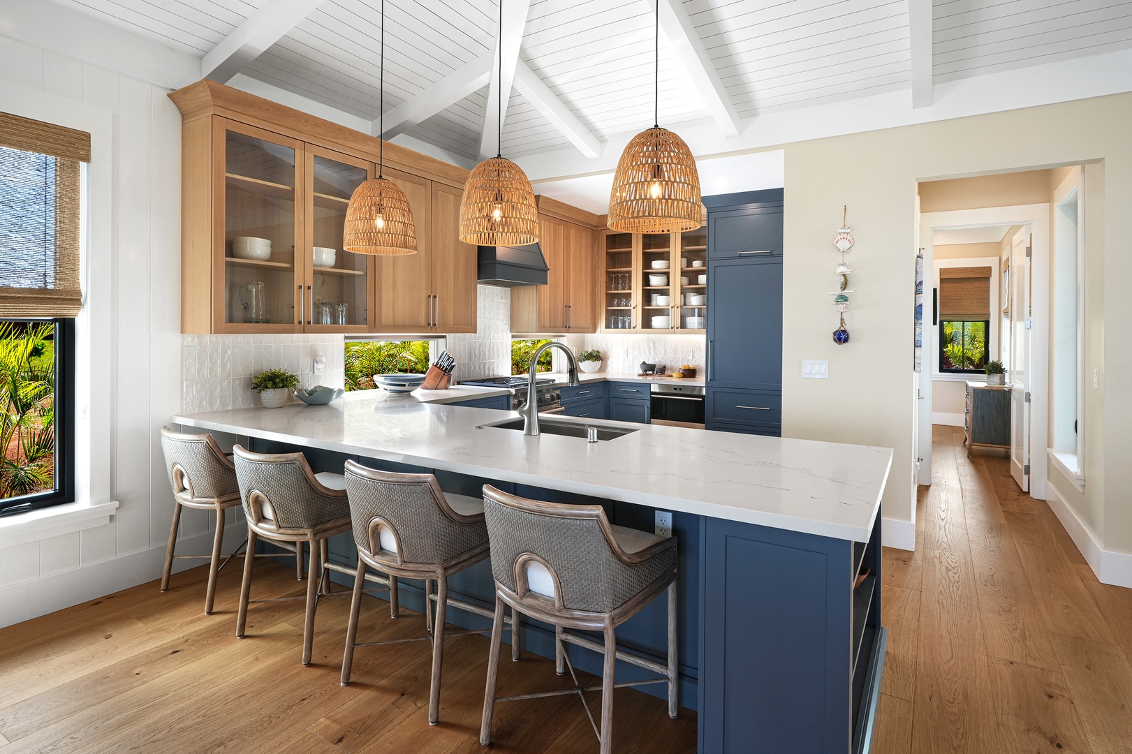 Koloa Vacation Rentals, Hali'a Mai - A long island with bar seating, where someone always ends up perched while dinner comes together.