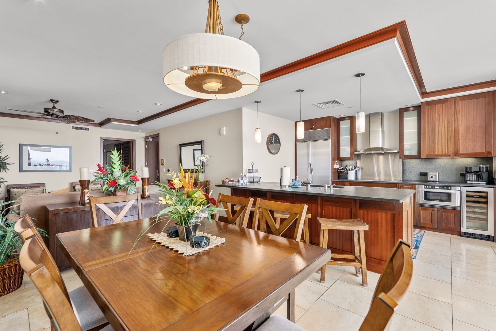 Kapolei Vacation Rentals, Ko Olina Beach Villas O1404 - Seat the whole group at the long dining table, the kitchen a step behind.