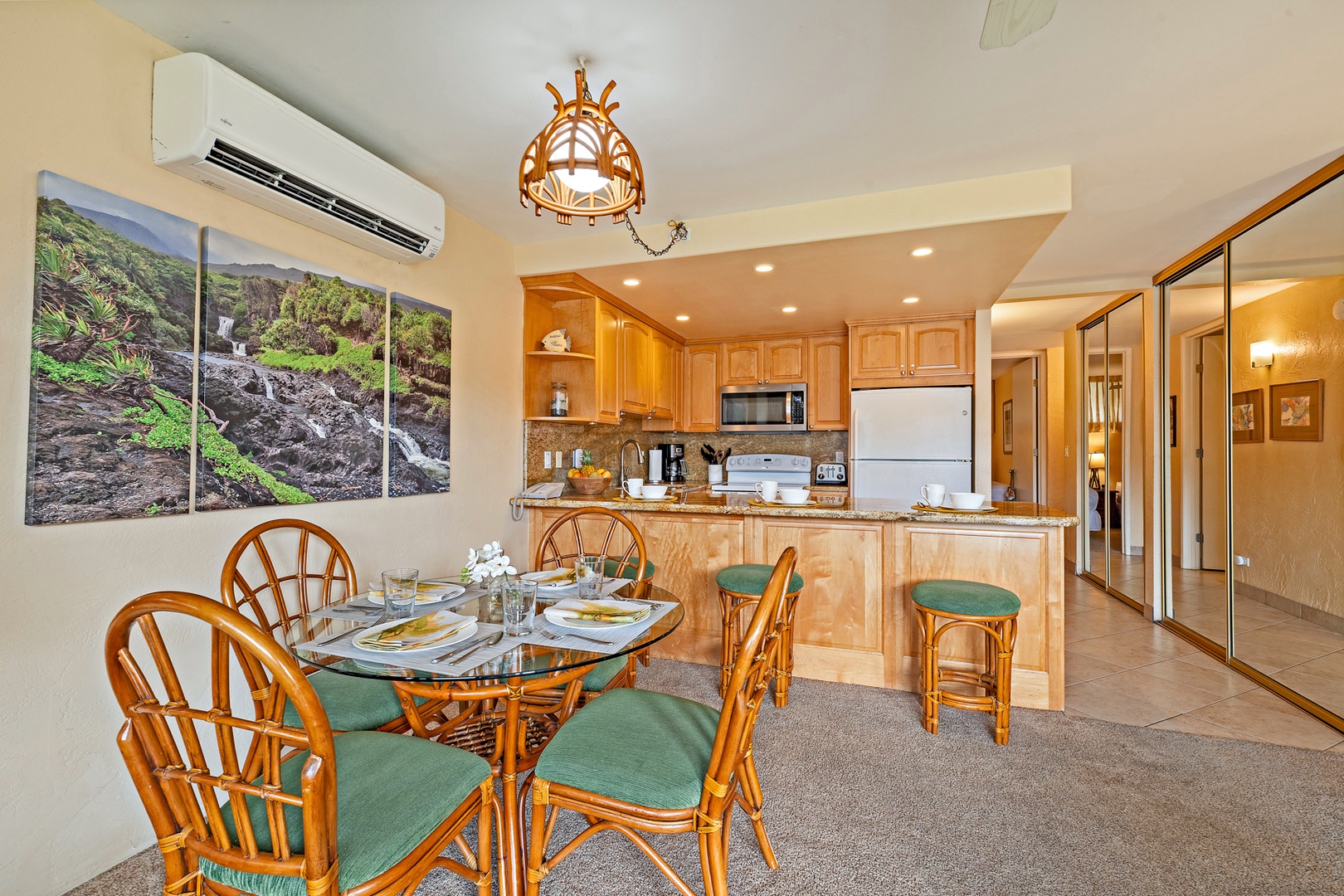 Lahaina Vacation Rentals, Papakea G-306 - The dining area offers a comfortable spot for meals, while the nearby kitchen and breakfast bar provide additional seating options for casual dining.