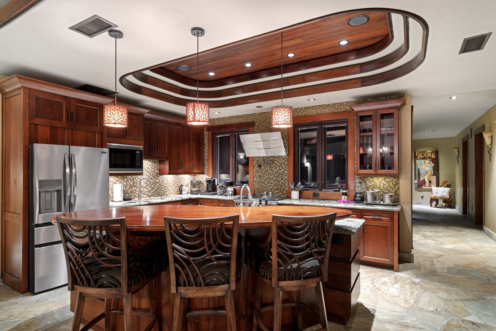 Kamuela Vacation Rentals, Hale Konane - Entertain effortlessly in the spacious kitchen with premium appliances and island bar seating.