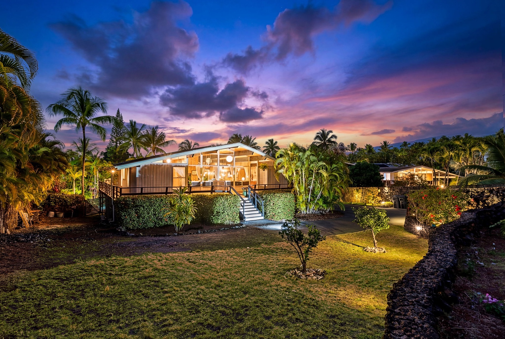 Kailua Kona Vacation Rentals, Mai Tai Manor - Your own modern tropical retreat surrounded by swaying palms and lush gardens beneath vibrant sunset skies.