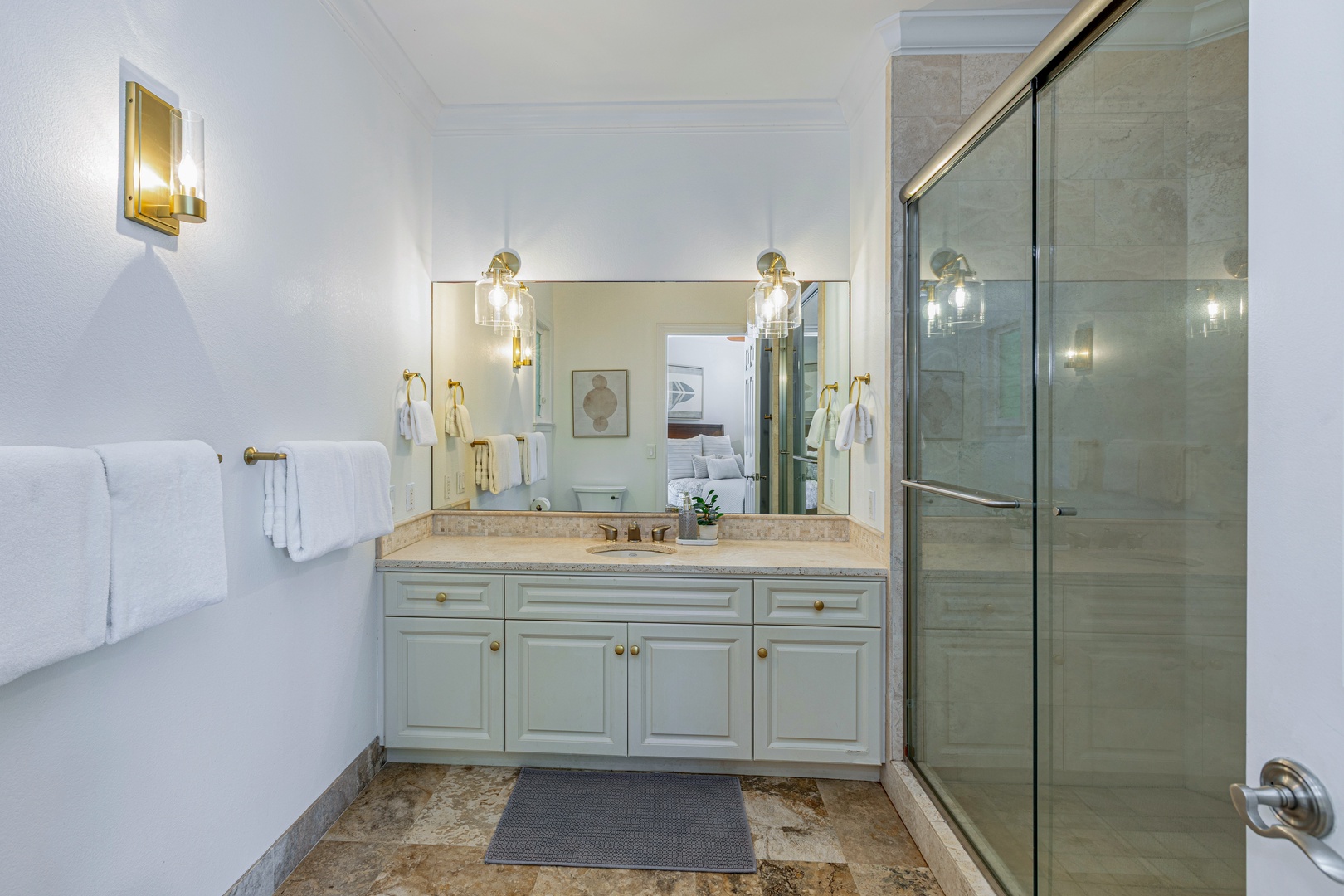 Princeville Vacation Rentals, Ohana Kamalani - Spacious ensuite bathroom with dual vanities, glass walk-in shower, and plenty of counter space.