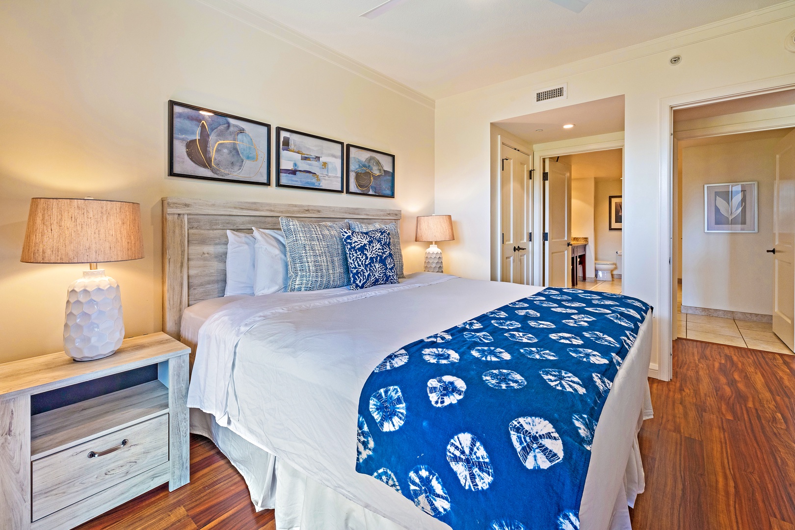 Lahaina Vacation Rentals, Honua Kai Konea 206 - The primary bedroom offers a king bed with soft linens and stylish décor, leading to a private ensuite bathroom for added comfort and convenience.