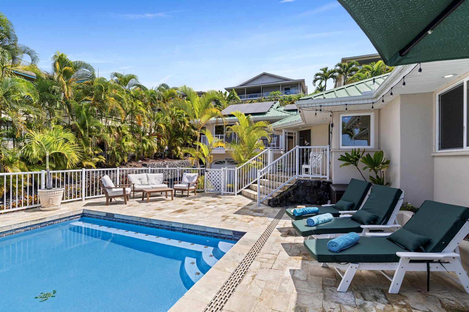Kailua-Kona Vacation Rentals, Honu Hale - Soak up the sunshine on your private poolside loungers, surrounded by swaying palms in this tropical paradise.