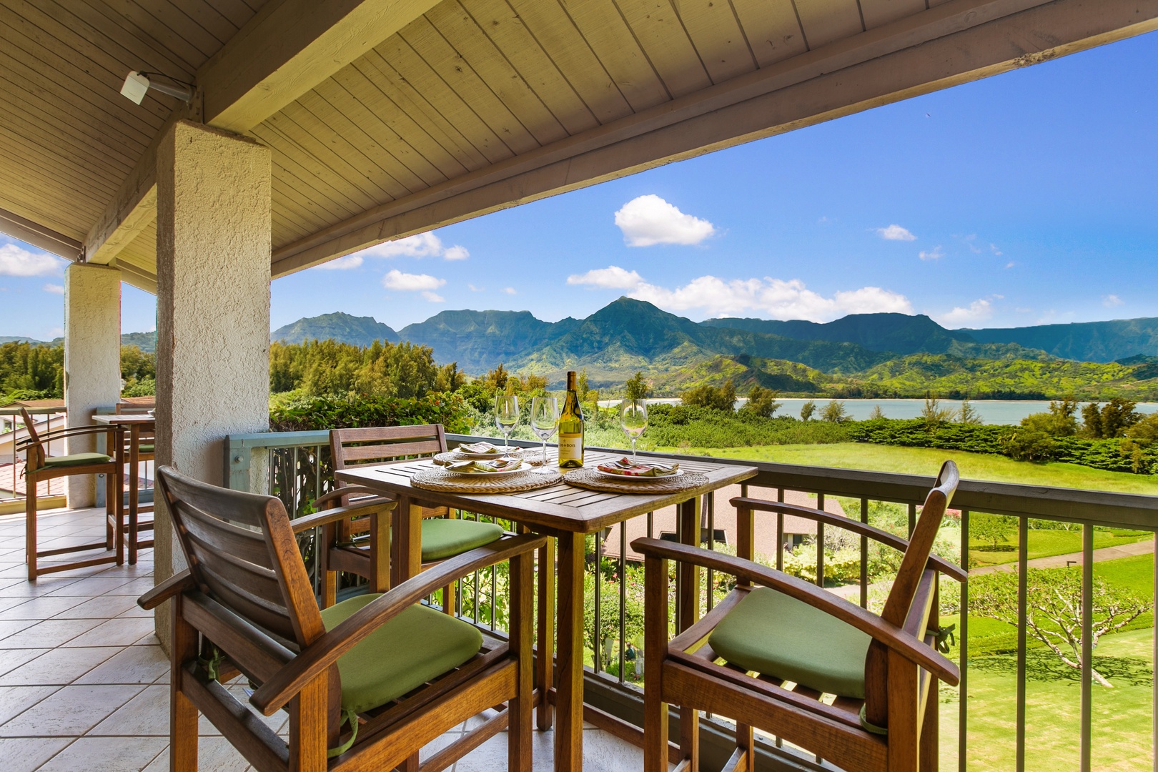 Princeville Vacation Rentals, Hanalei Bay Resort 4302 - Enjoy al-fresco dining on the lanai with scenic Hanalei Bay and mountain views.