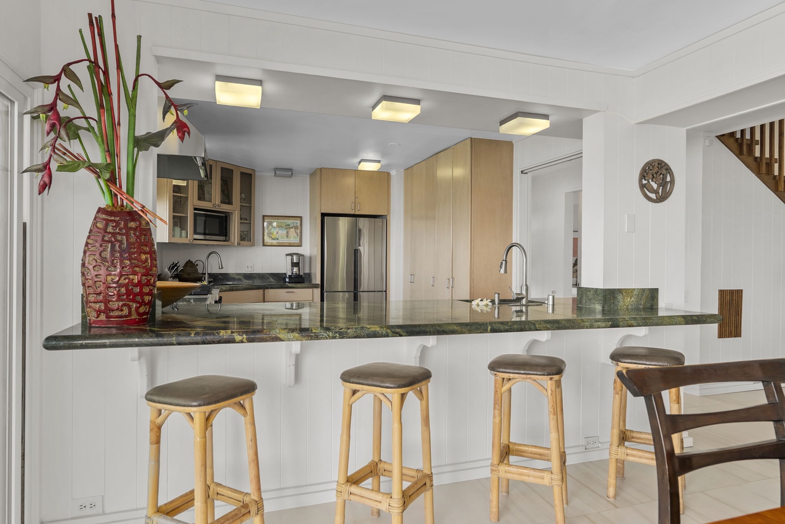 Waianae Vacation Rentals, Ma'ili Blue Estate - Gather around this spacious granite-topped kitchen island where you'll love preparing meals and sharing stories over morning coffee.